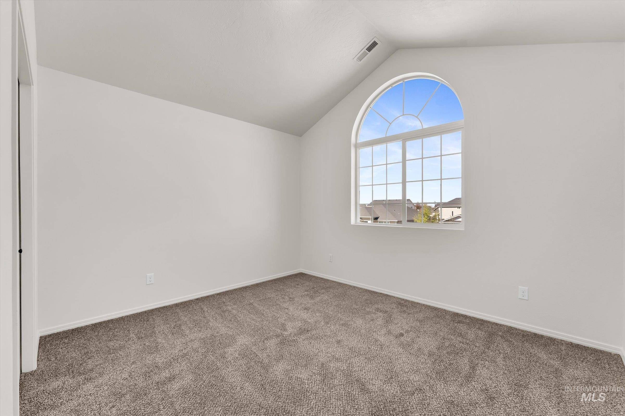 5602 Barkley Way Caldwell, ID 83607 - Photo 25 of 36 Additional living space with dark colored carpet and baseboards