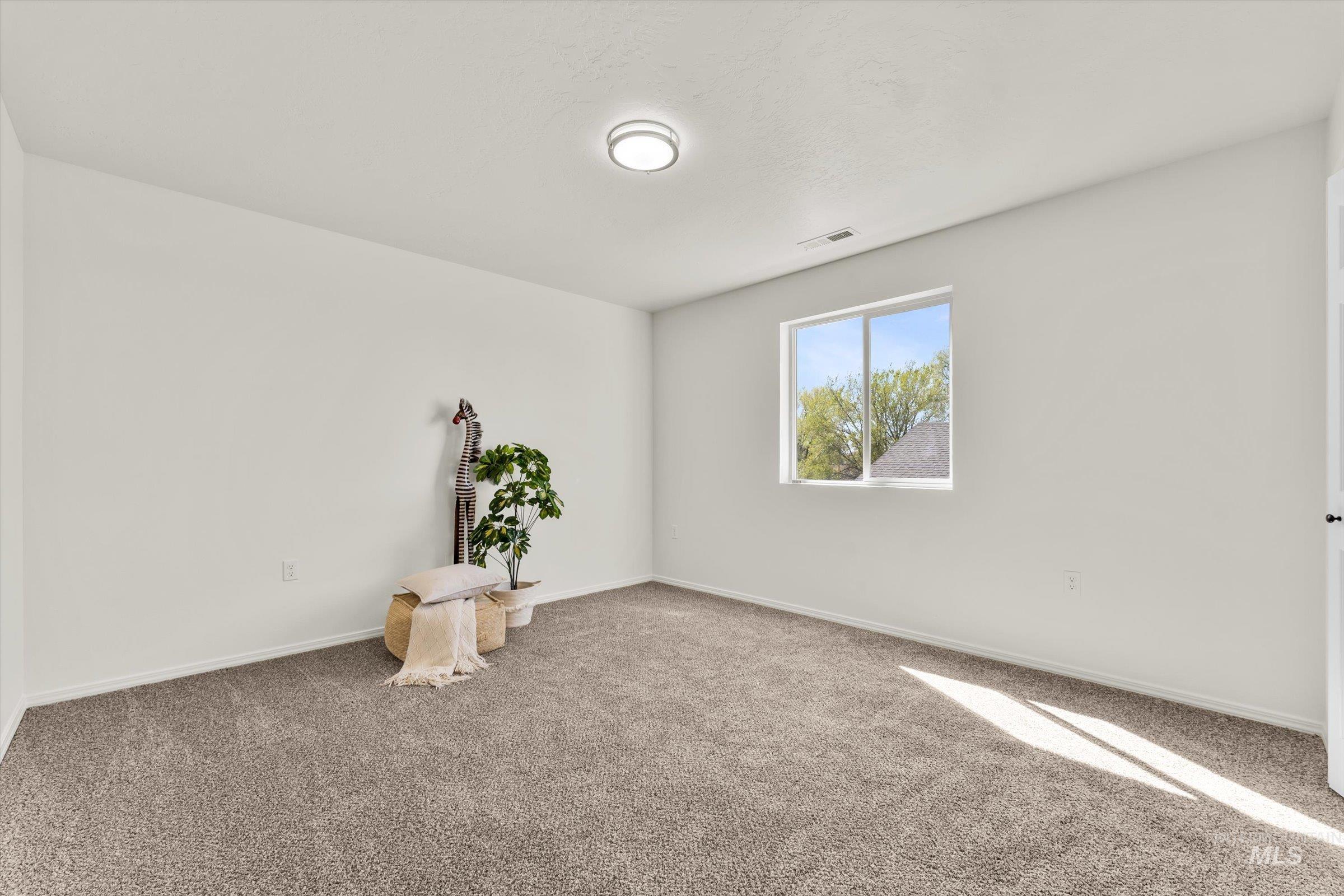 5602 Barkley Way Caldwell, ID 83607 - Photo 28 of 36 Unfurnished room with carpet flooring and baseboards