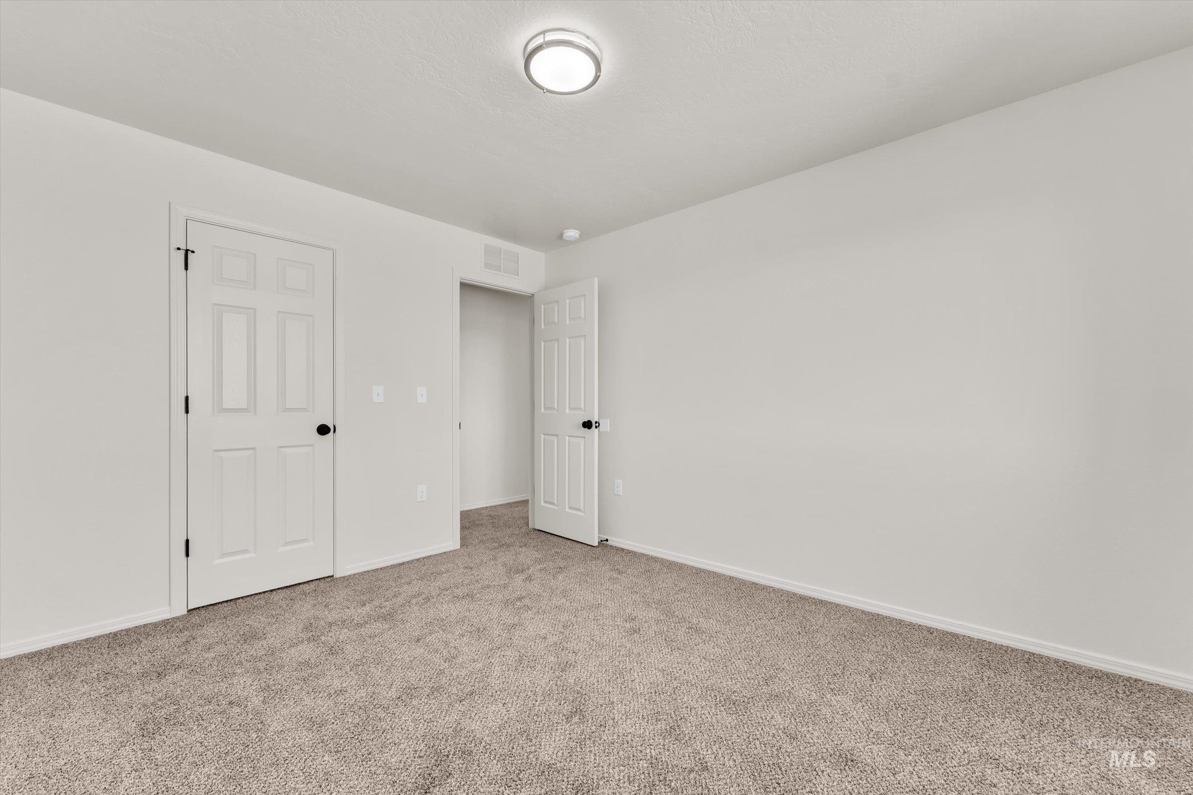 5602 Barkley Way Caldwell, ID 83607 - Photo 29 of 36 Unfurnished bedroom featuring carpet and baseboards