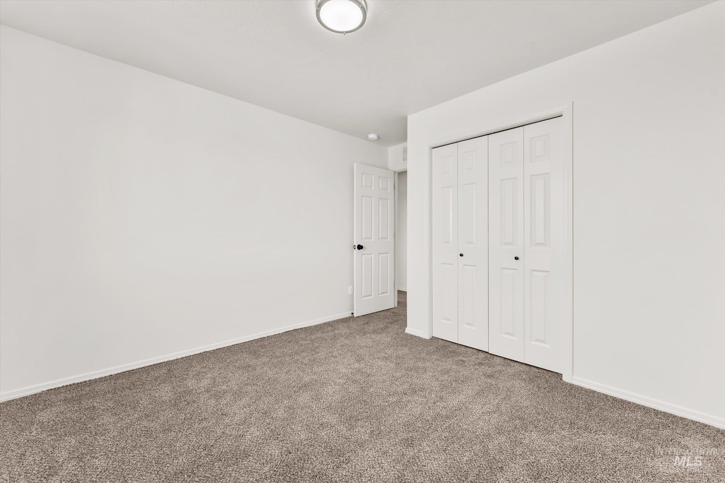 5602 Barkley Way Caldwell, ID 83607 - Photo 30 of 36 Unfurnished bedroom with carpet and a closet