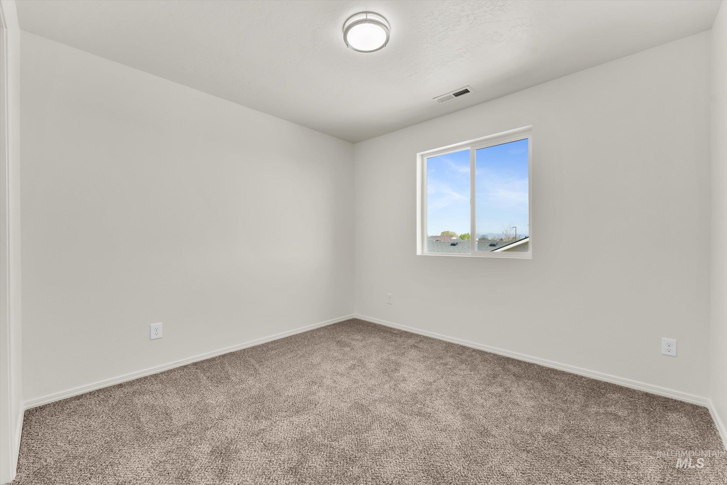 5602 Barkley Way Caldwell, ID 83607 - Photo 31 of 36 Carpeted empty room with baseboards