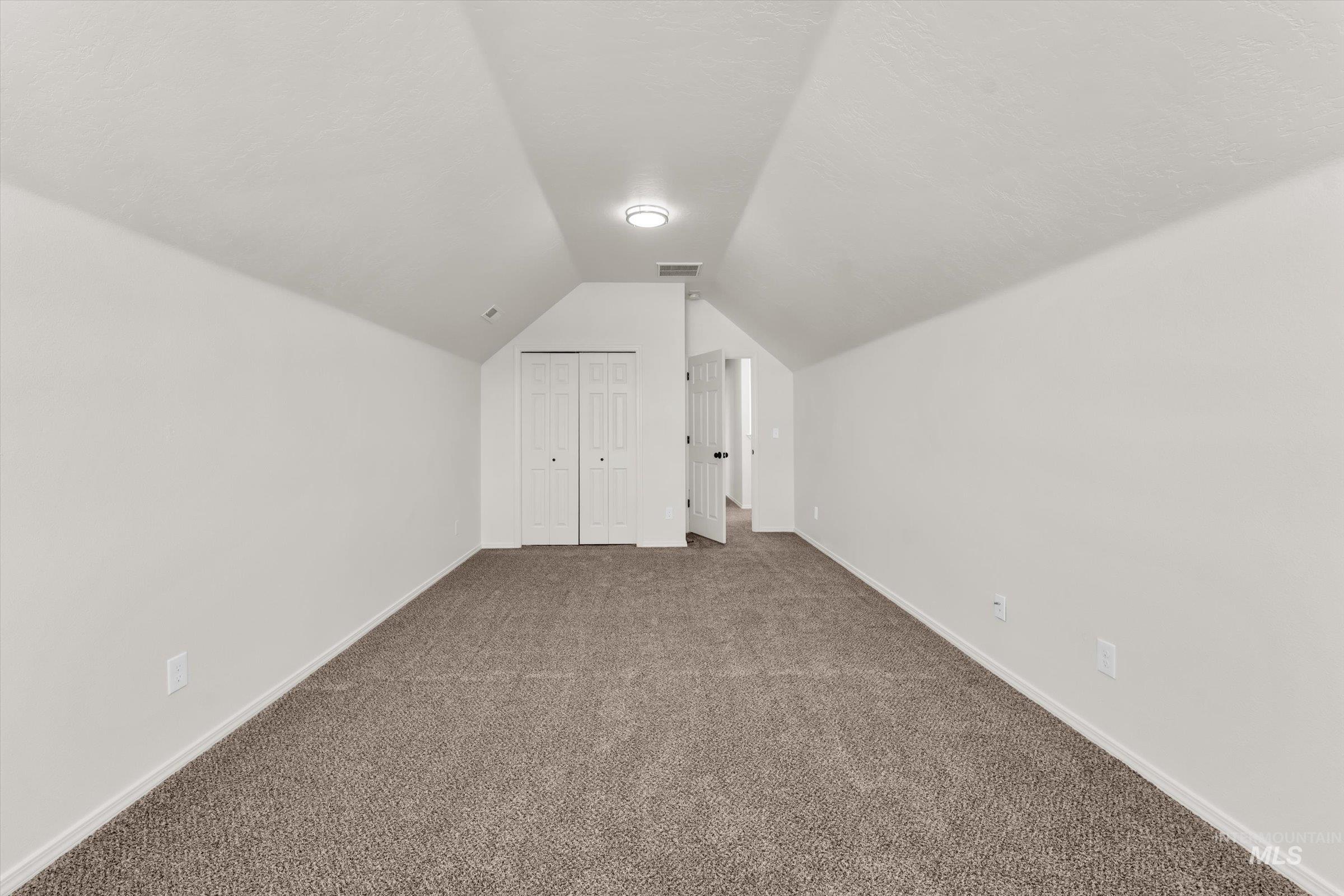 5602 Barkley Way Caldwell, ID 83607 - Photo 32 of 36 Additional living space featuring dark colored carpet and baseboards