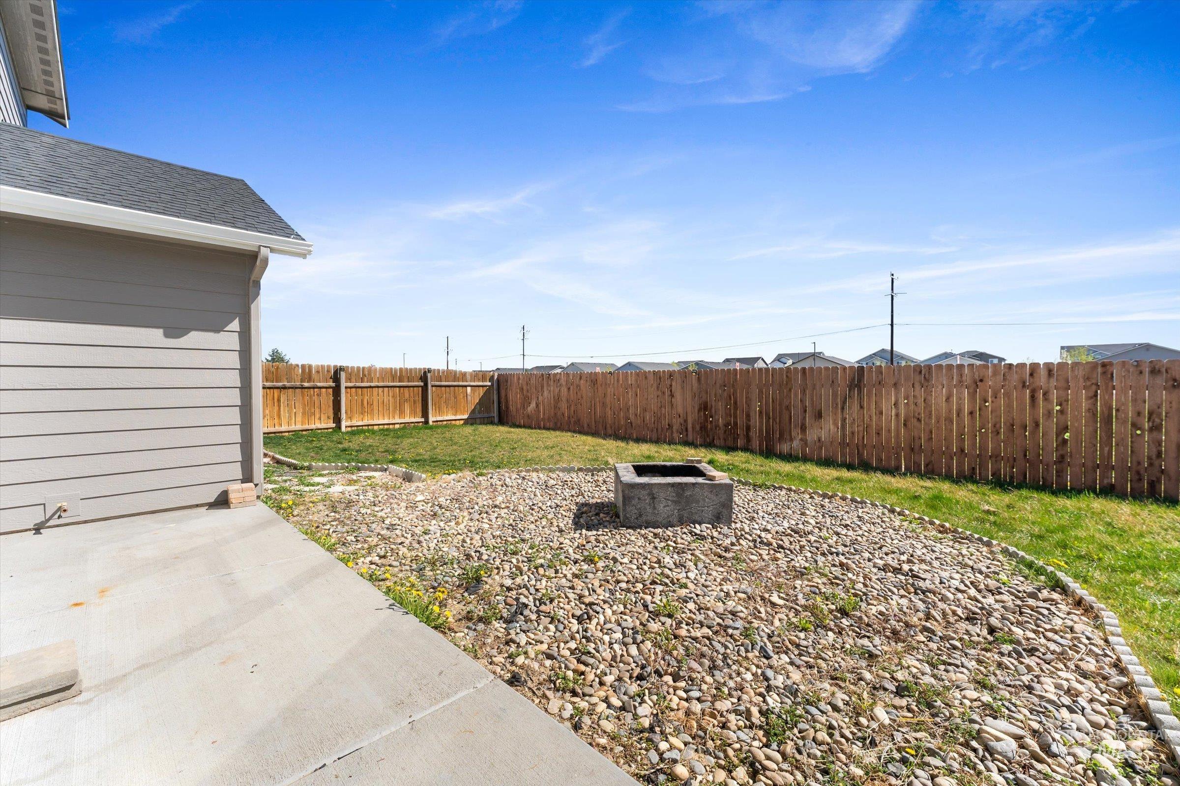 5602 Barkley Way Caldwell, ID 83607 - Photo 35 of 36 Fenced backyard featuring a fire pit and a patio