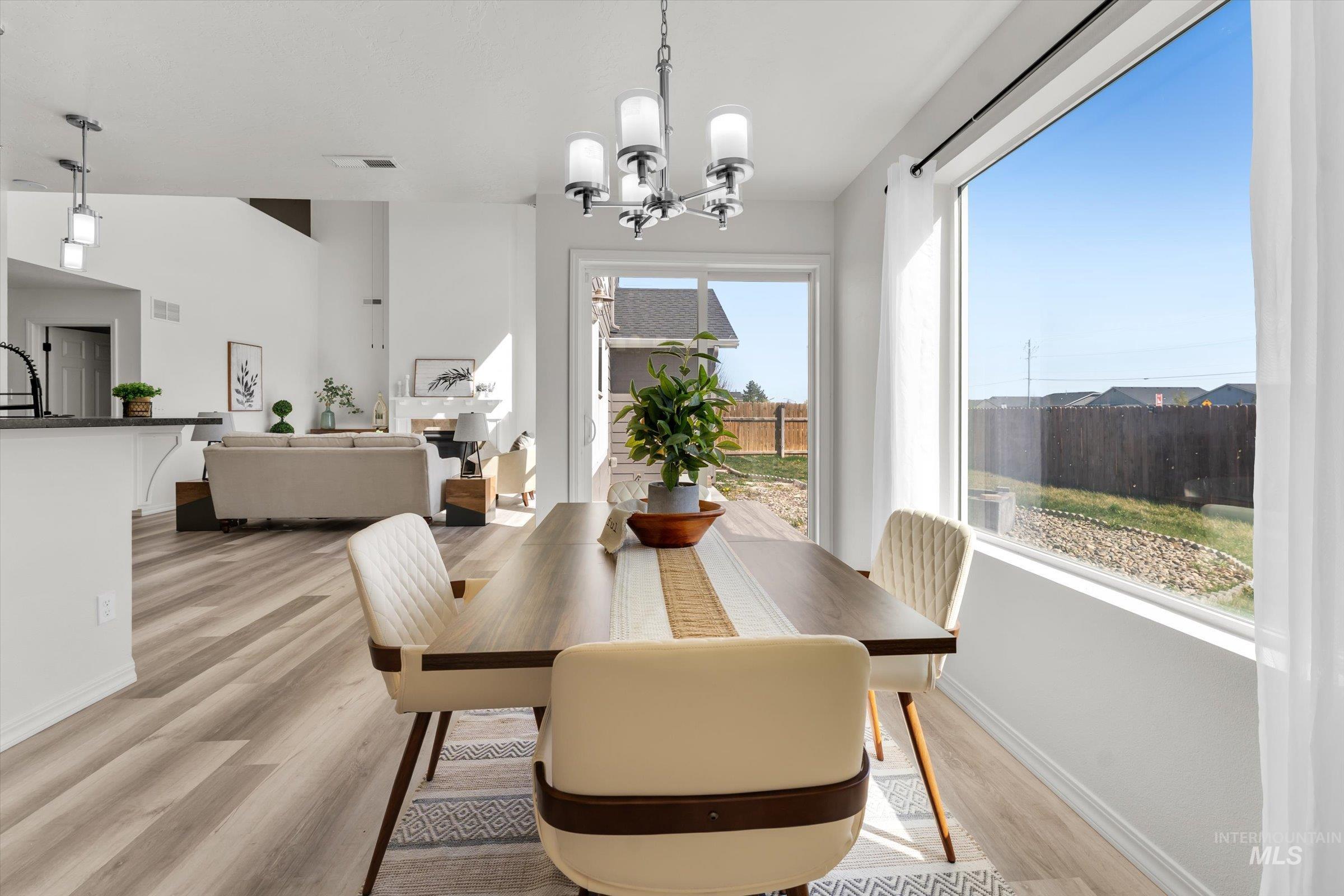 5602 Barkley Way Caldwell, ID 83607 - Photo 6 of 36 Dining room with suspended lighting and light wood finished floors