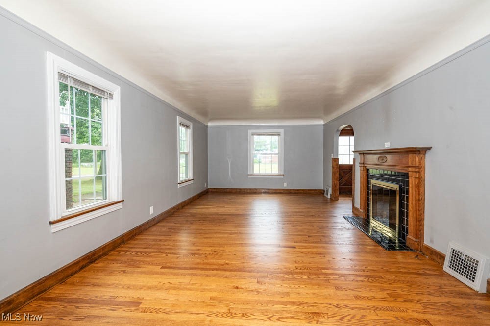 272 Ewing Road Youngstown, OH 44512 - Photo 7 of 19 Living room with newly refinished hardwood floors and fireplace