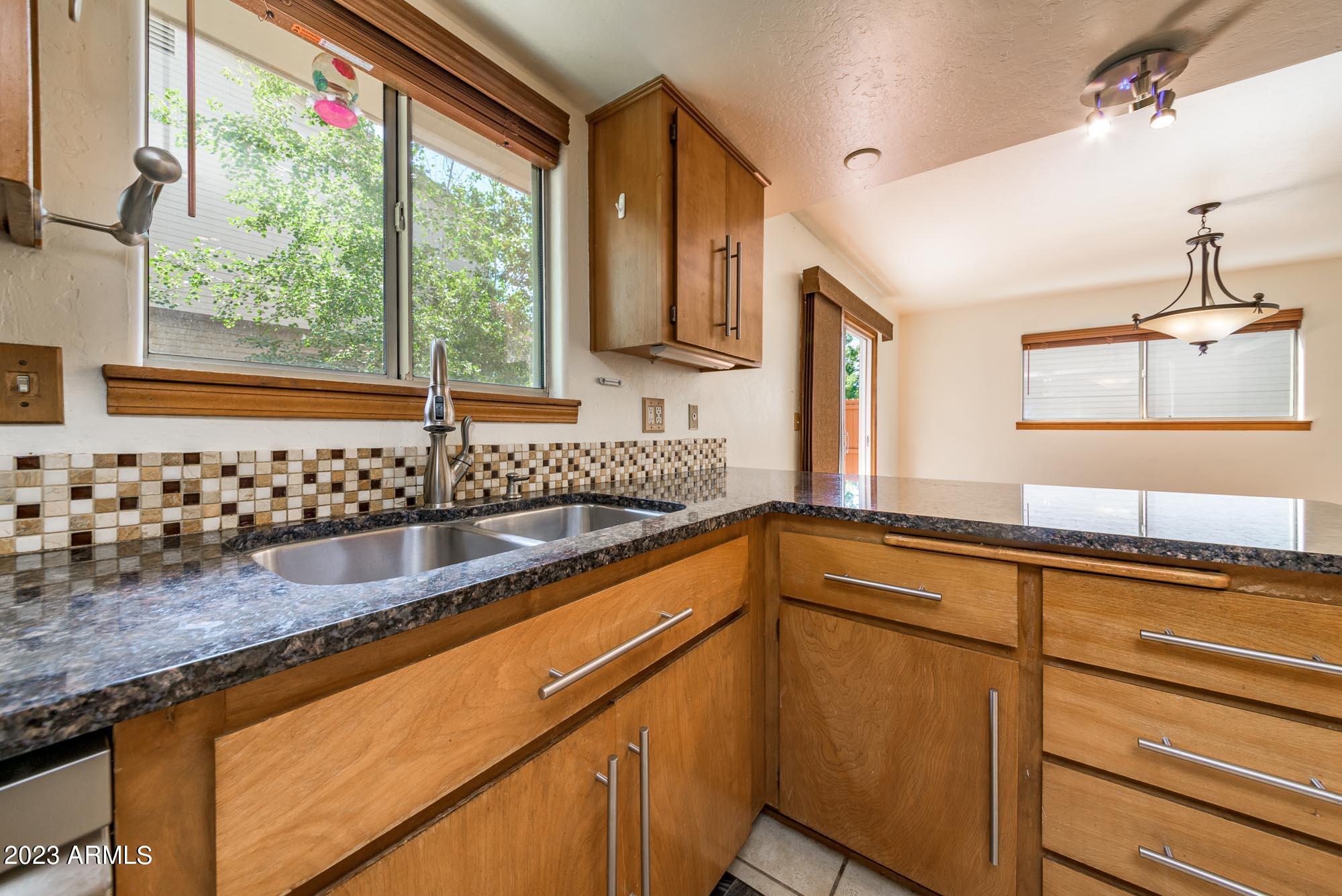 3124 Kyle Loop Flagstaff, AZ 86004 - Photo 12 of 31 Kitchen Sink Facing Backyard