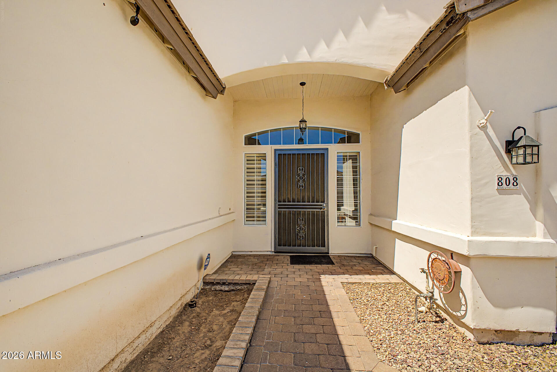808 West Citrus Way Phoenix, AZ 85013 - Photo 4 of 35 a view of a hallway with wooden floor and staircase