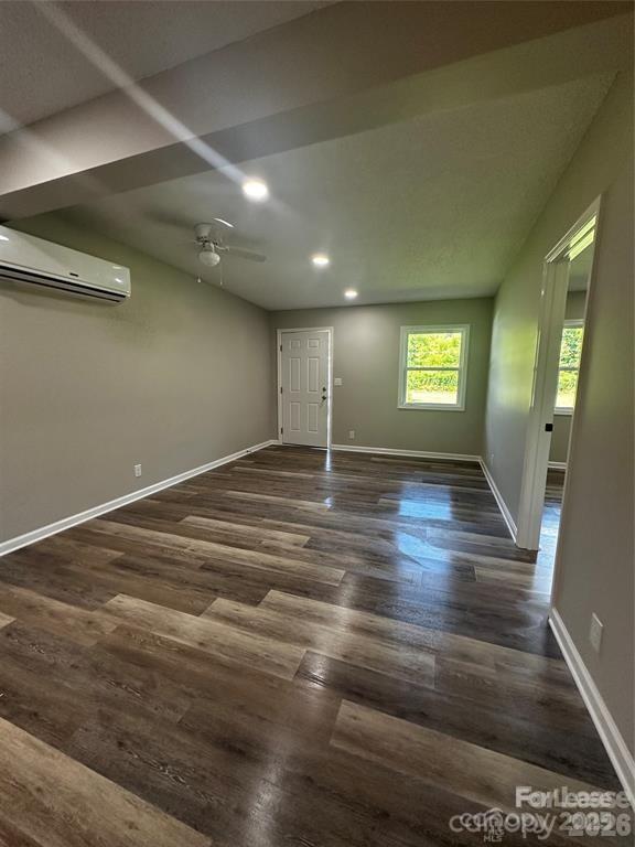 43 Hawkins Road, Unit 1 Marion, NC 28752 - Photo 7 of 10 an empty room with wooden floor and windows