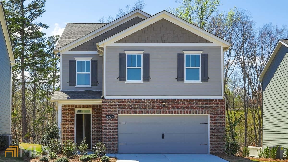 a front view of a house with yard