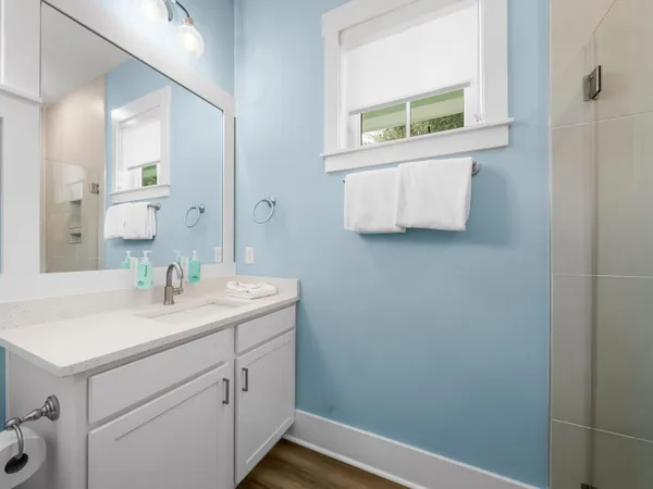 a bathroom with a sink and a window