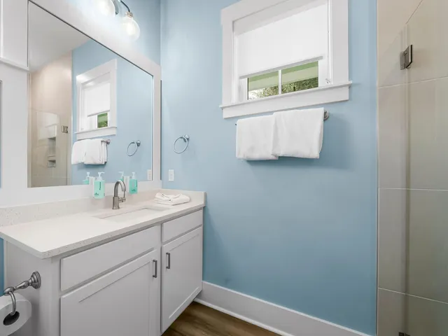 a bathroom with a sink and a window