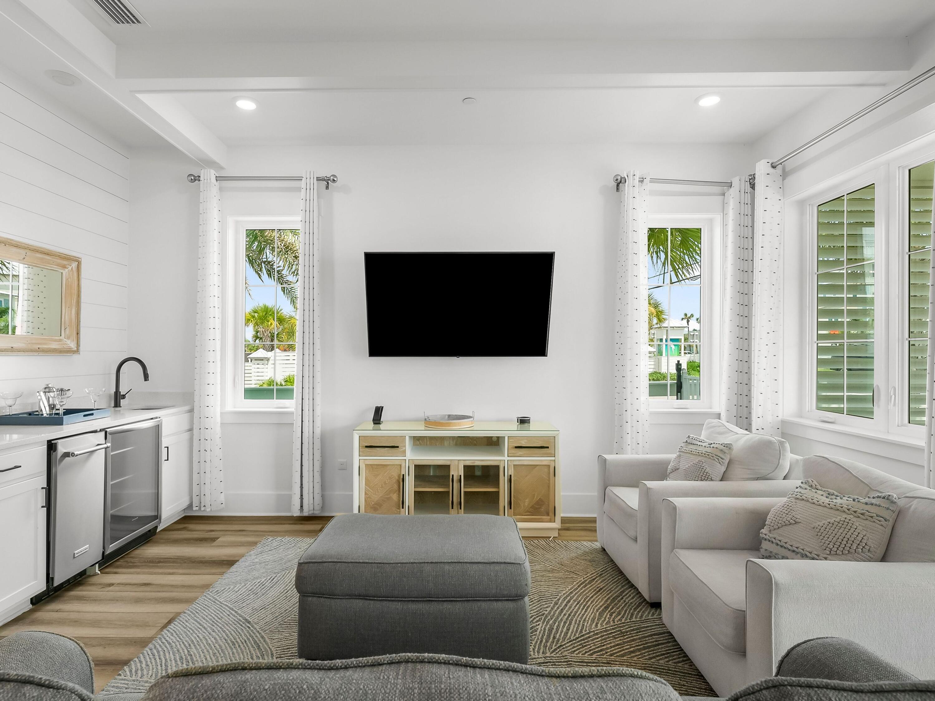 13650 Front Beach Road Panama City Beach, FL 32413 - Photo 13 of 49 a living room with furniture and a flat screen tv