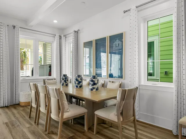 a view of a dining room with furniture and windows
