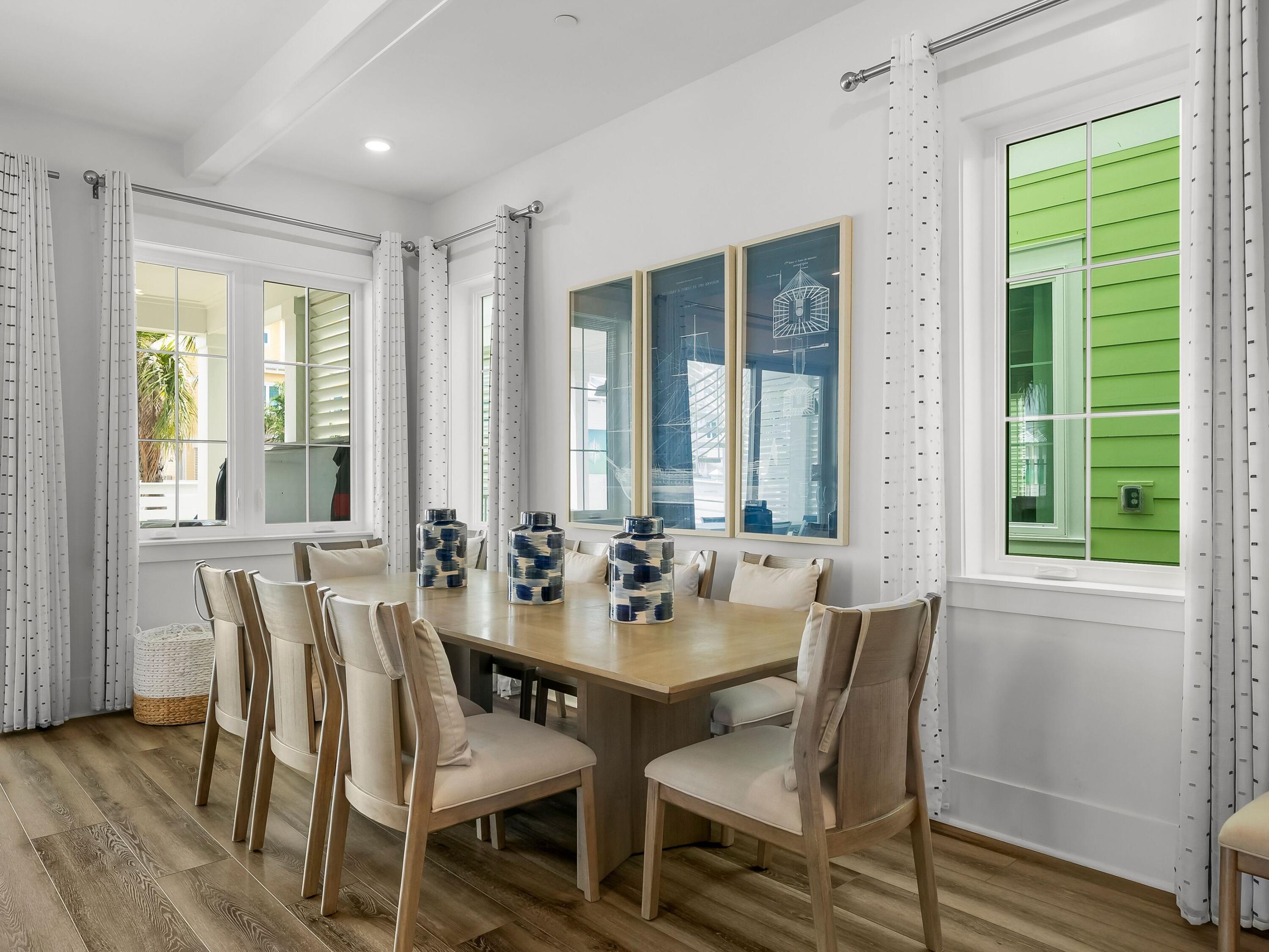13650 Front Beach Road Panama City Beach, FL 32413 - Photo 15 of 49 a view of a dining room with furniture and windows