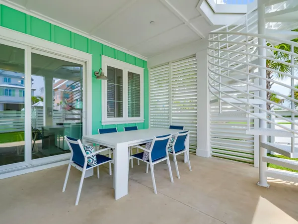 a dining room with furniture and a window