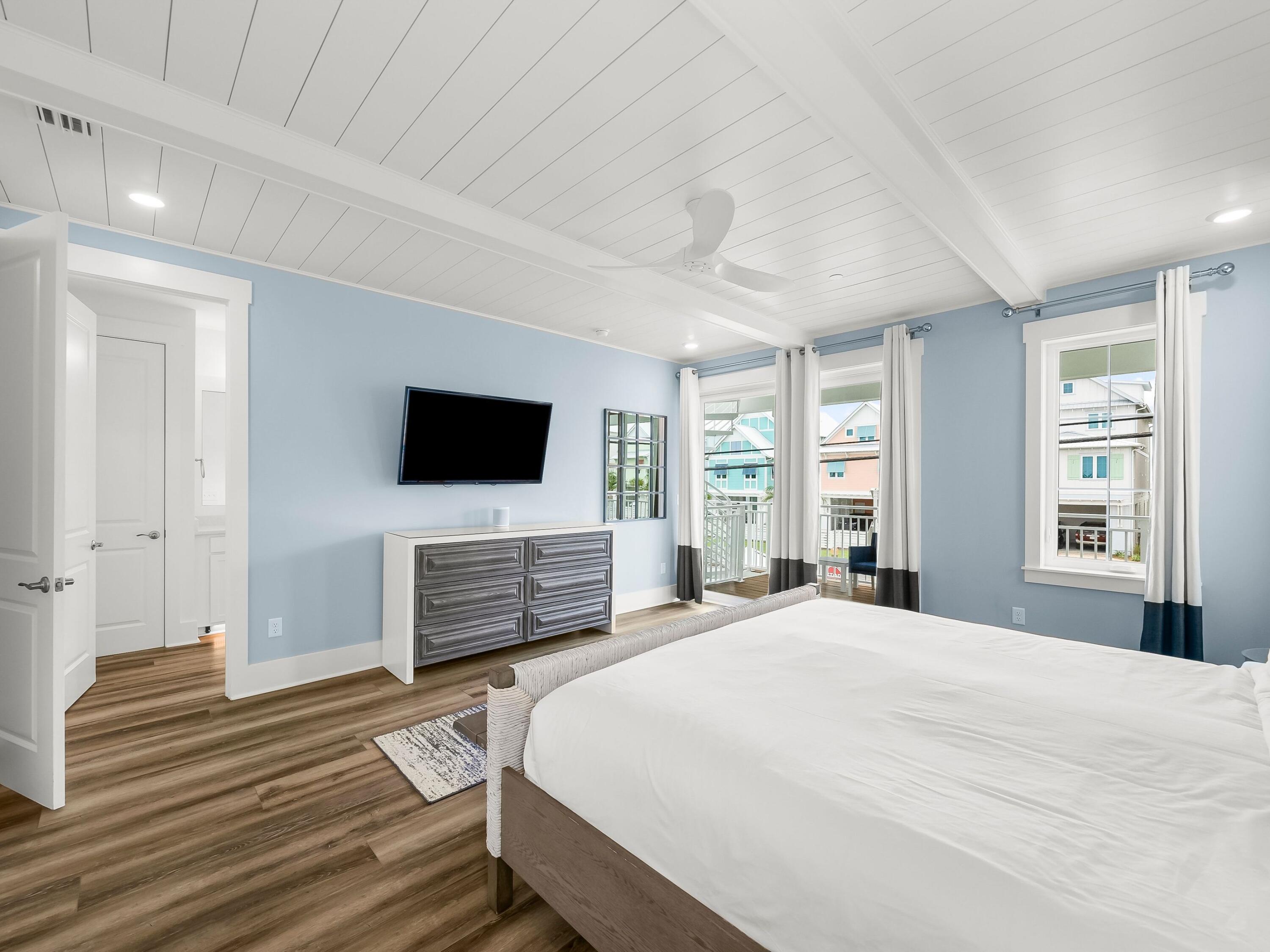 13650 Front Beach Road Panama City Beach, FL 32413 - Photo 27 of 49 a bedroom with a bed and a flat screen tv