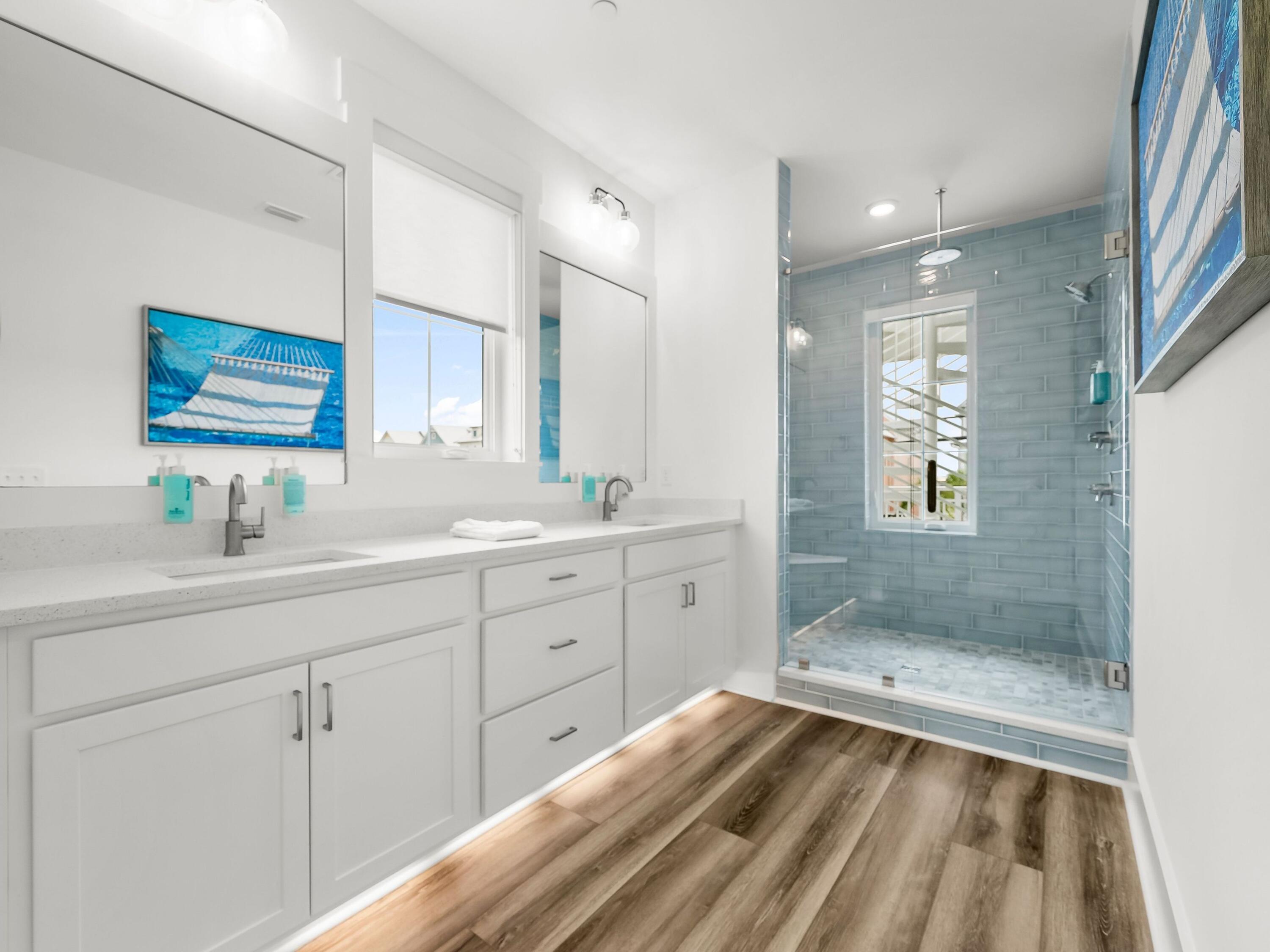 13650 Front Beach Road Panama City Beach, FL 32413 - Photo 28 of 49 a spacious bathroom with a shower sink and mirror