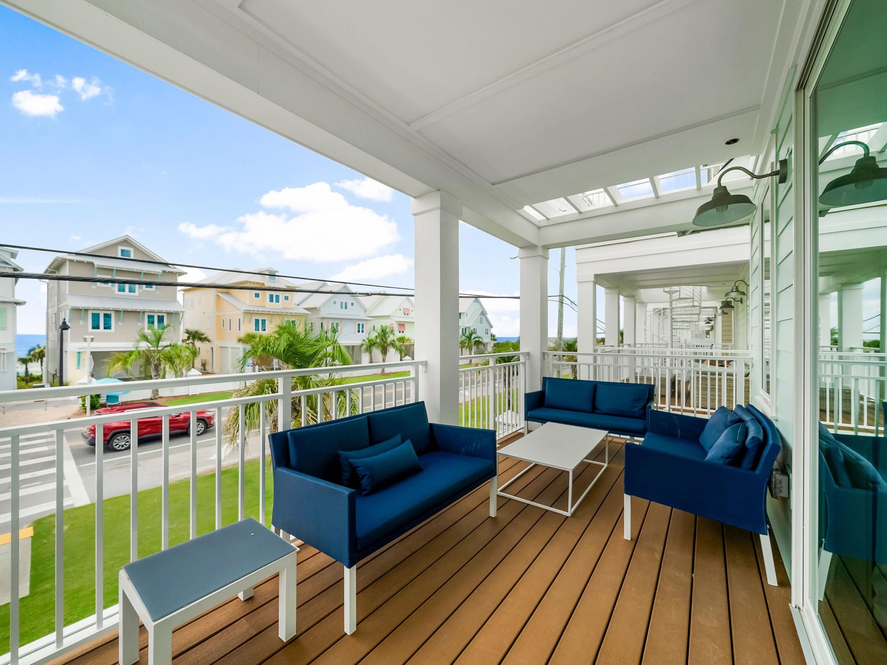 13650 Front Beach Road Panama City Beach, FL 32413 - Photo 30 of 49 a living room filled with furniture and a table