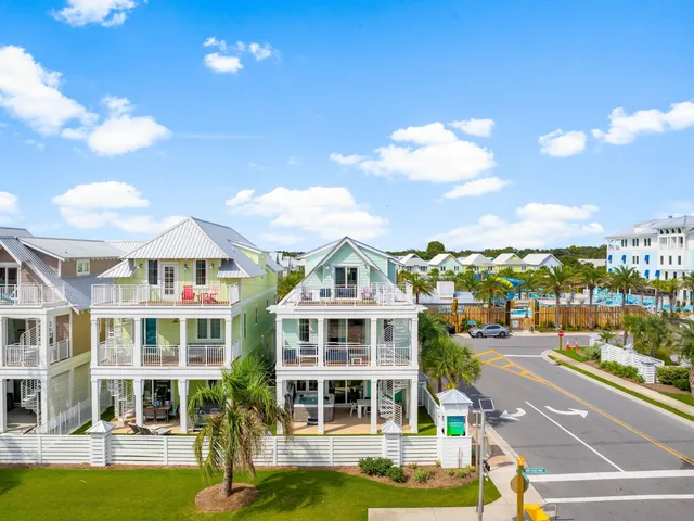 a view of a large building with a big yard and large trees