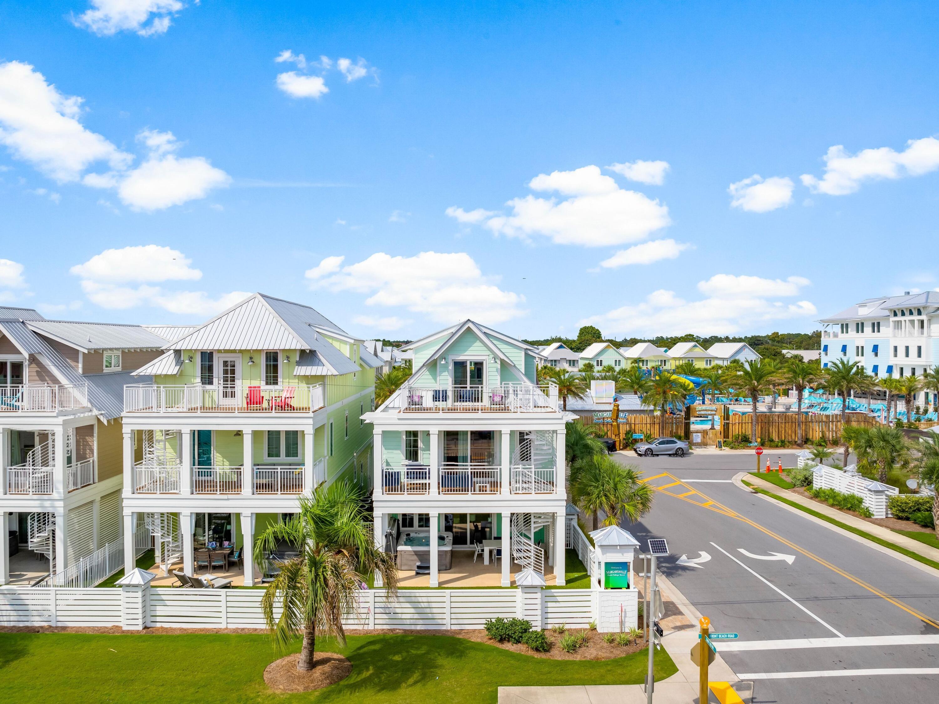 13650 Front Beach Road Panama City Beach, FL 32413 - Photo 3 of 49 a view of a large building with a big yard and large trees