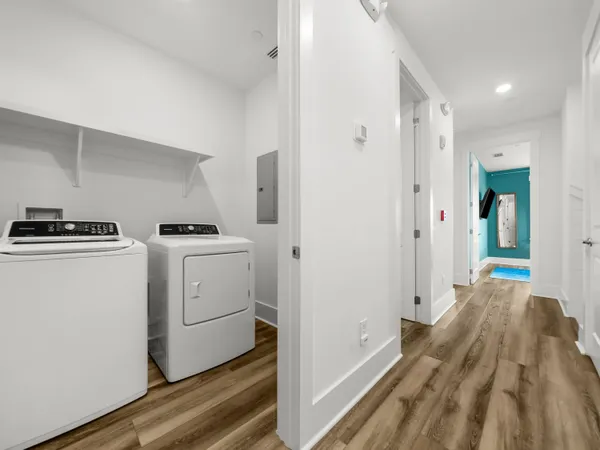 a bedroom with bed and a flat tv screen on dresser