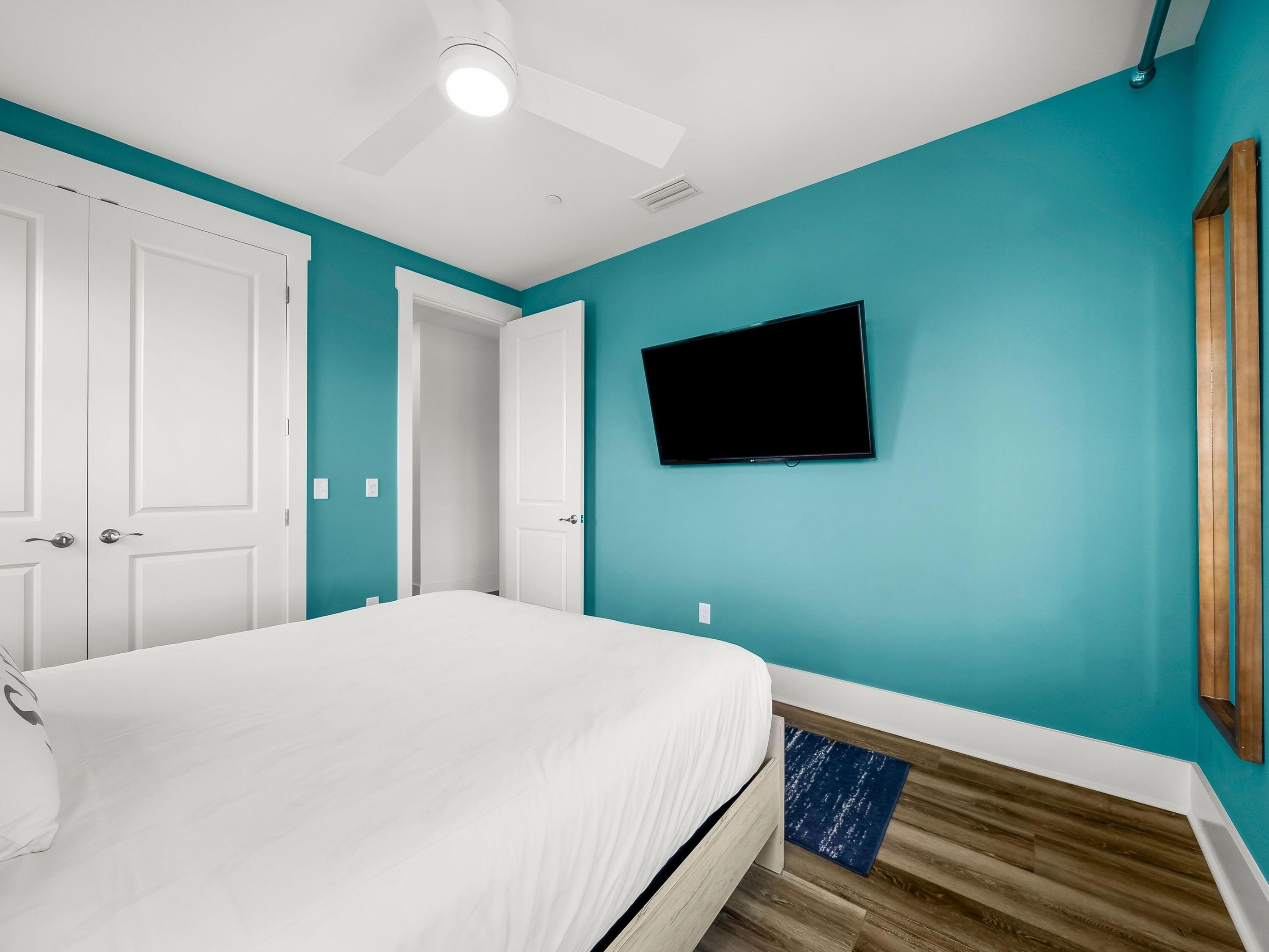 13650 Front Beach Road Panama City Beach, FL 32413 - Photo 35 of 49 a bedroom with a bed and a flat screen tv