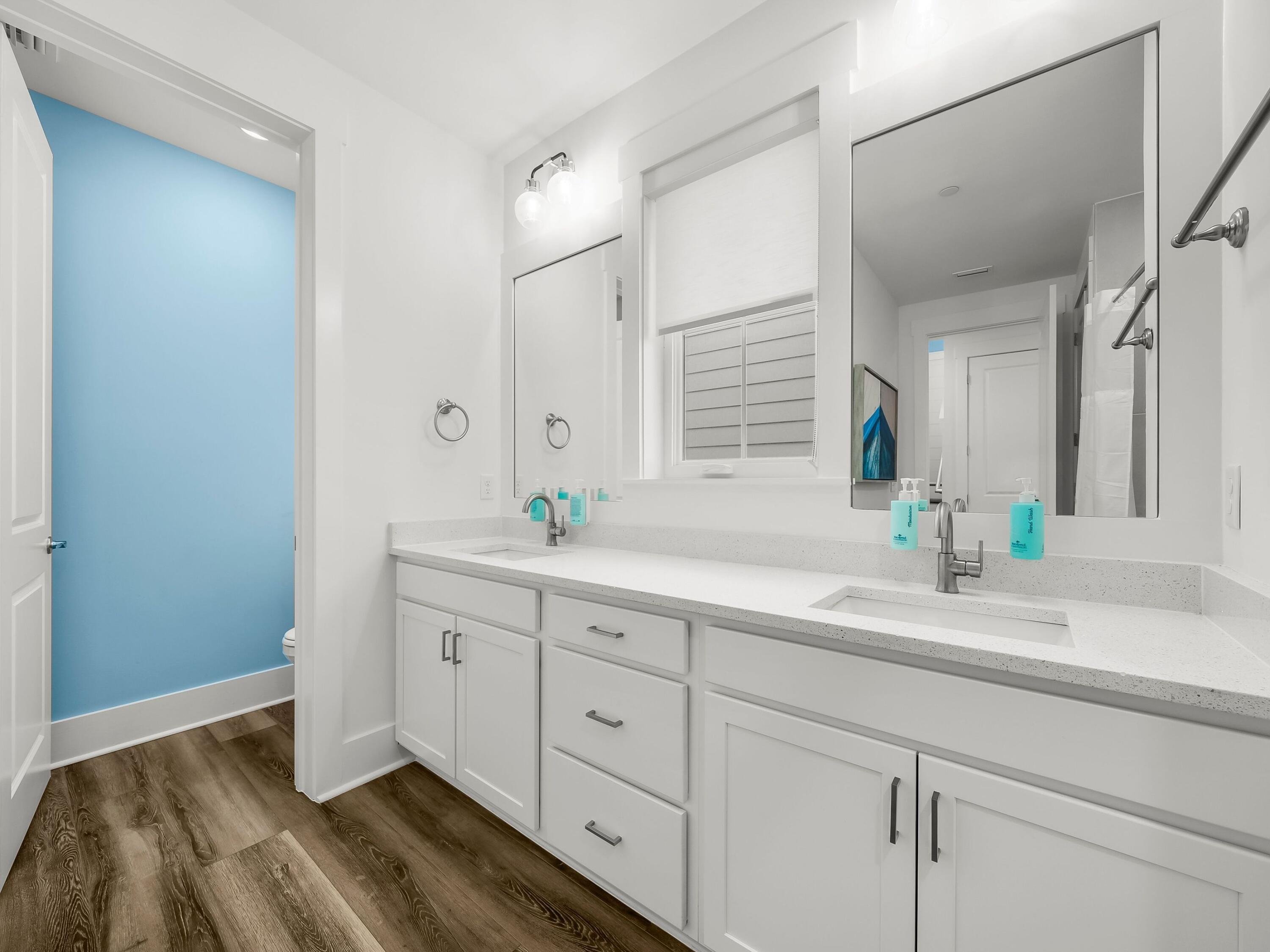 13650 Front Beach Road Panama City Beach, FL 32413 - Photo 37 of 49 a spacious bathroom with double sink and a mirror