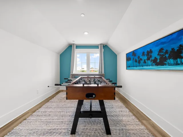 a room with a table and a painting on the wall