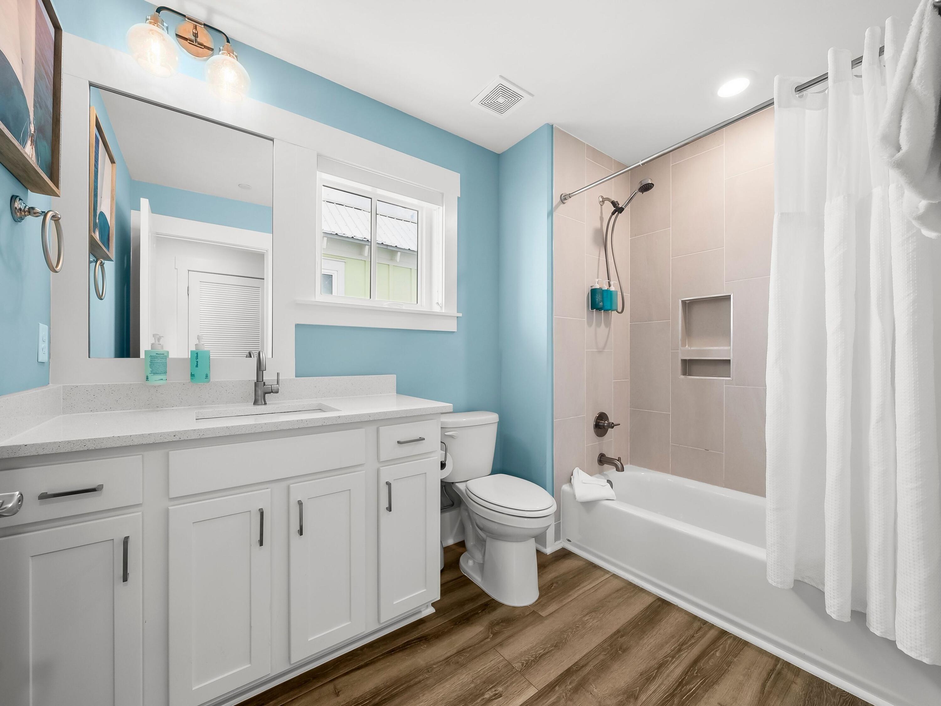 13650 Front Beach Road Panama City Beach, FL 32413 - Photo 43 of 49 a bathroom with a granite countertop sink toilet a shower and a mirror