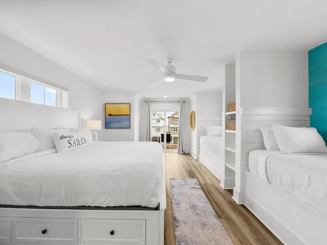 a bedroom with a large bed and a couch