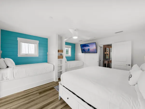a bed room with a bed and a tv