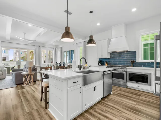 a kitchen with stainless steel appliances granite countertop a stove and cabinets
