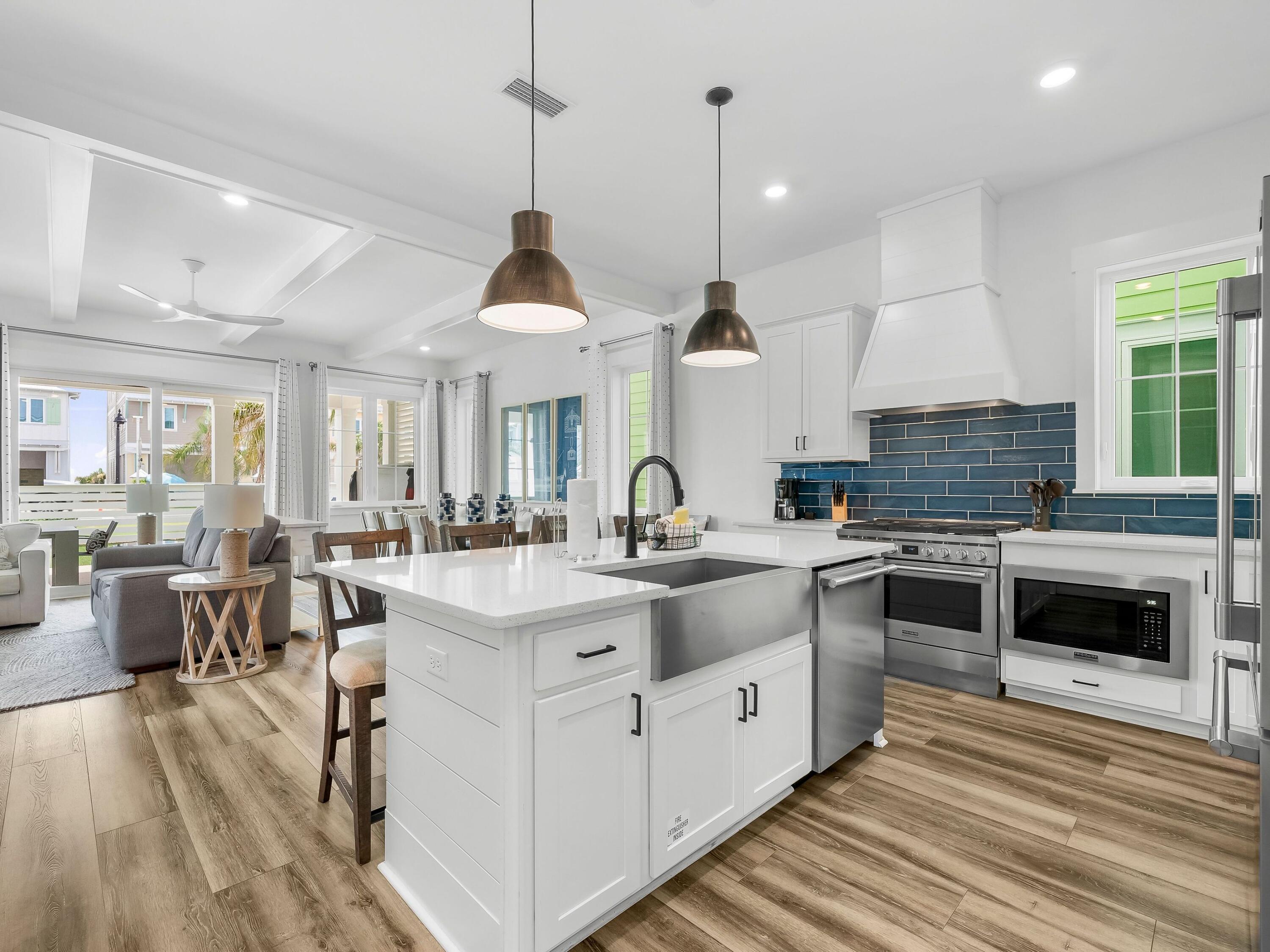 13650 Front Beach Road Panama City Beach, FL 32413 - Photo 6 of 49 a kitchen with stainless steel appliances granite countertop a stove and cabinets