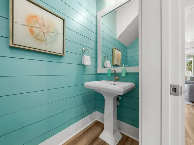 a bathroom with a sink toilet and mirror
