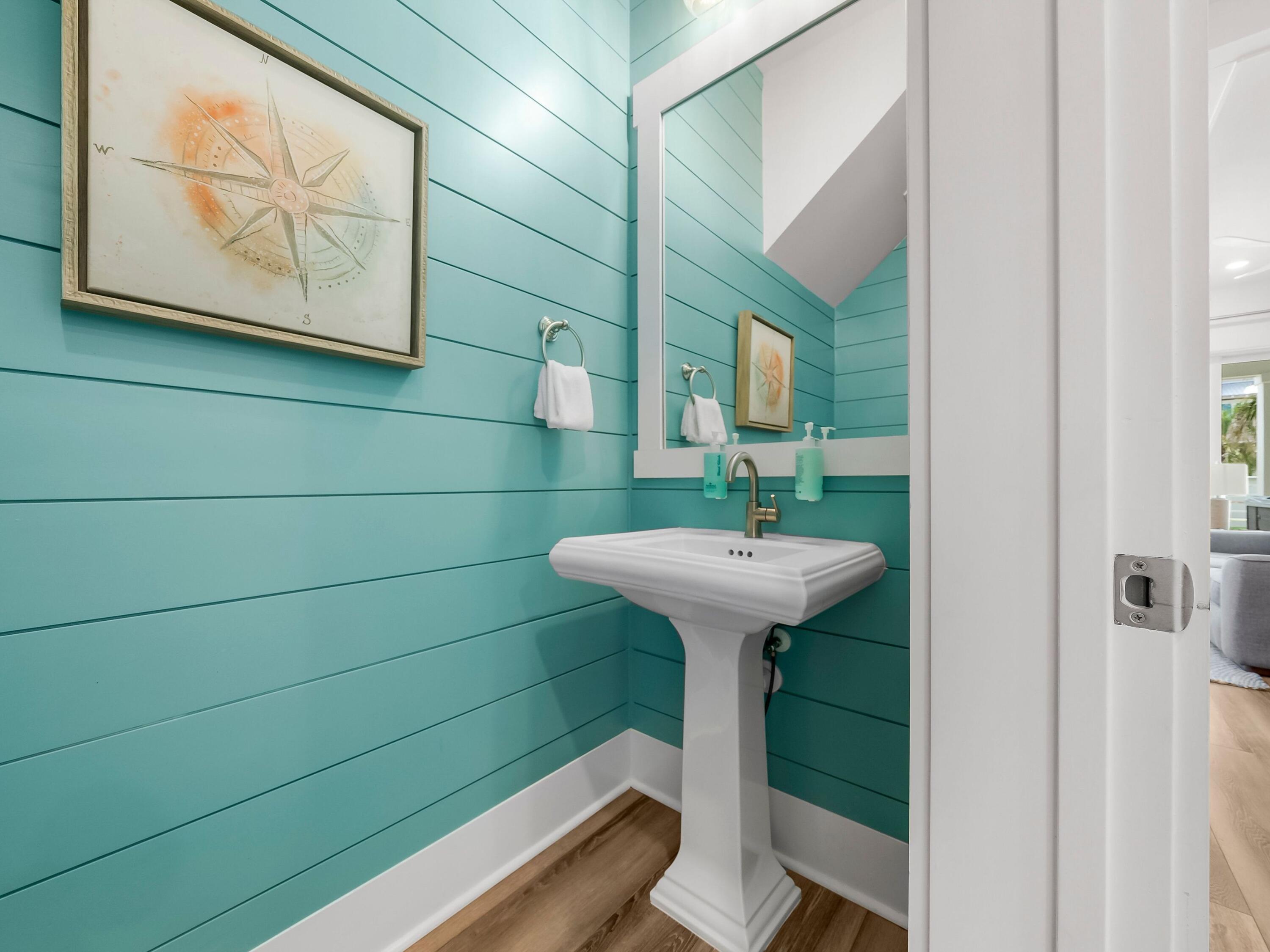 13650 Front Beach Road Panama City Beach, FL 32413 - Photo 8 of 49 a bathroom with a sink toilet and mirror