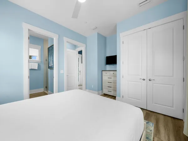 a bedroom with a bed and a closet