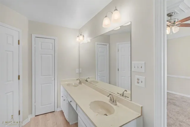 a bathroom with a sink double vanity and a mirror