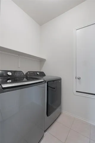 a view of a house with a yard and porch