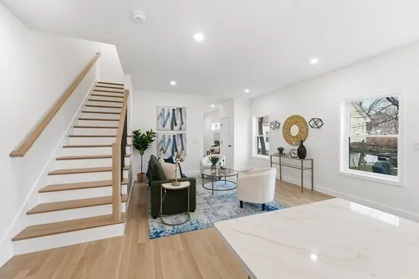a bathroom with a sink vanity granite and toilet