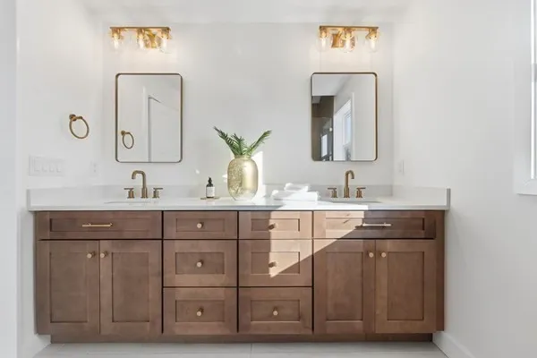 a bedroom with a large bed and a painting on the wall