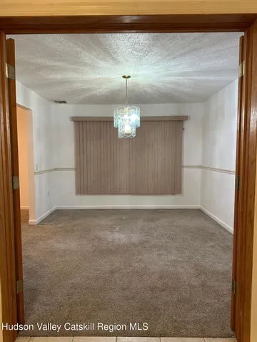 a white toilet sitting next to a window