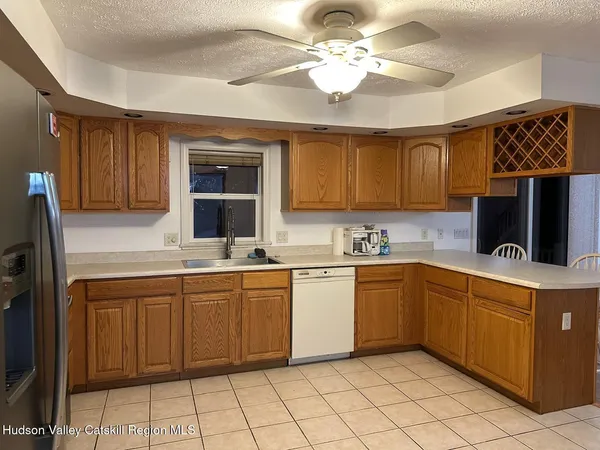 a kitchen with a sink cabinets and window