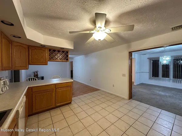 a kitchen with stainless steel appliances a sink stove and cabinets