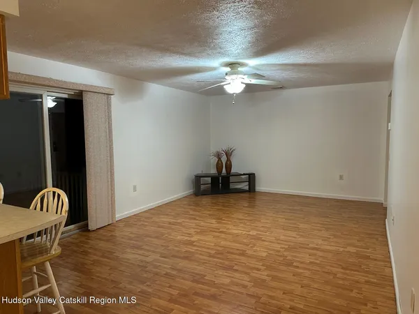 a view of room with a ceiling fan