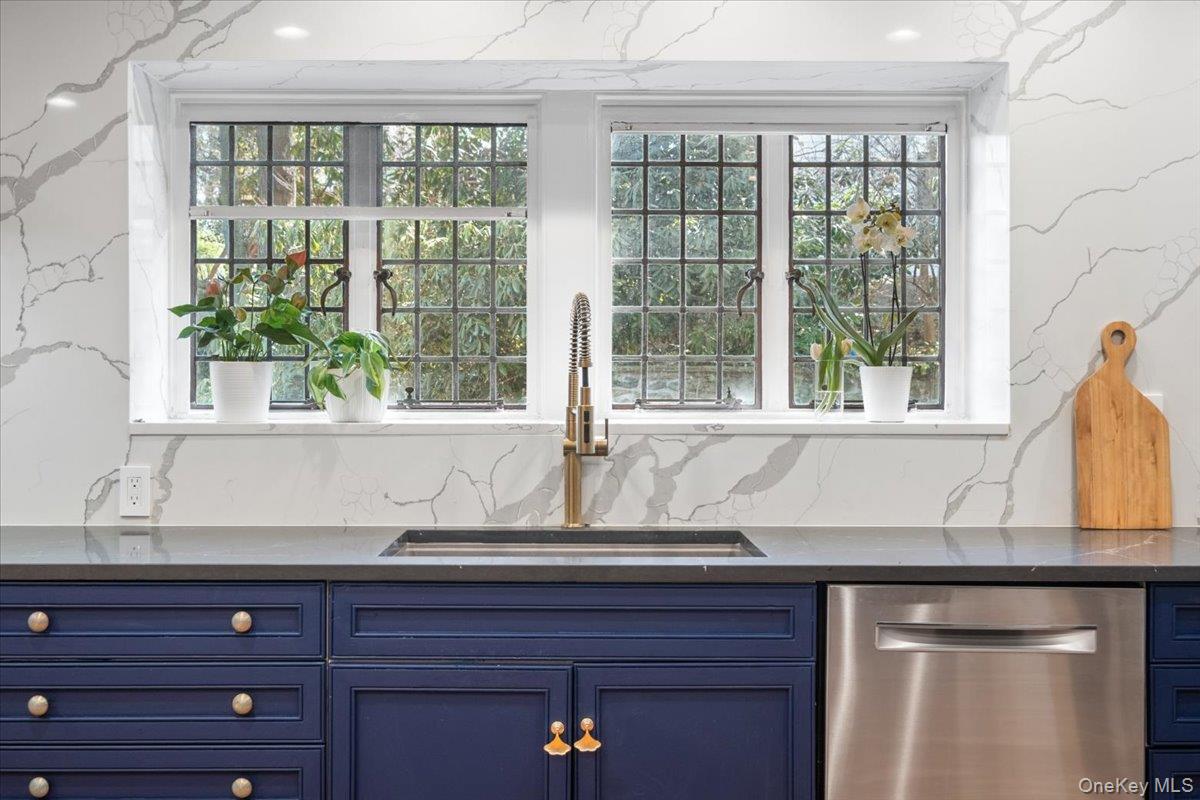 66 Lockwood Road Scarsdale, NY 10583 - Photo 25 of 47 Kitchen with views of the private backyard