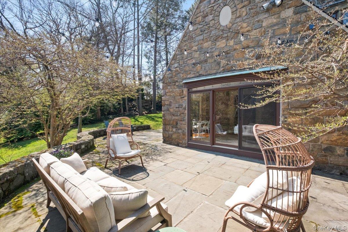 66 Lockwood Road Scarsdale, NY 10583 - Photo 8 of 47 Sunroom patio for seamless indoor-outdoor living