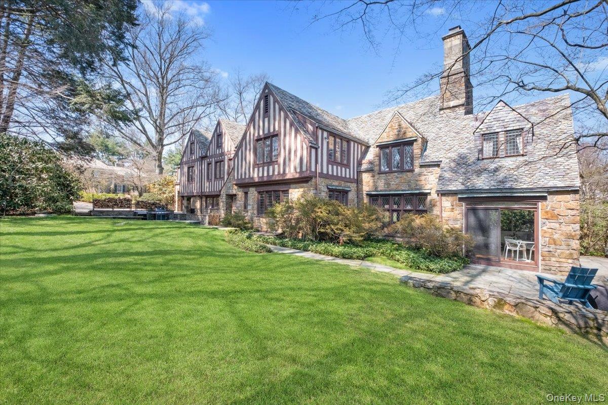 66 Lockwood Road Scarsdale, NY 10583 - Photo 9 of 47 Lush backyard with dual patios off the sunroom and kitchen