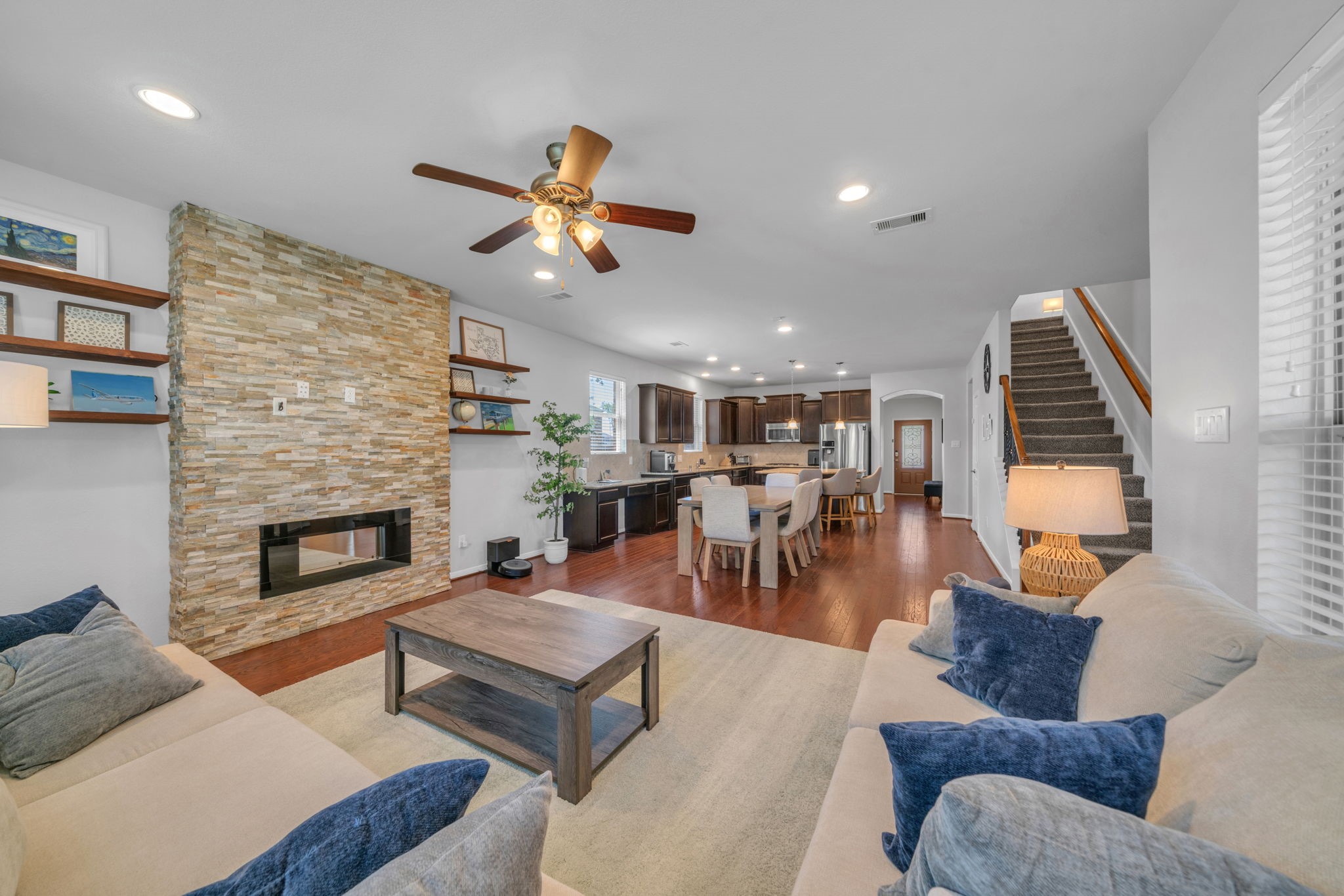 6427 Addlestone Ridge Lane Katy, TX 77494 - Photo 9 of 32 Decorative stone fireplace creates a cozy gathering area.