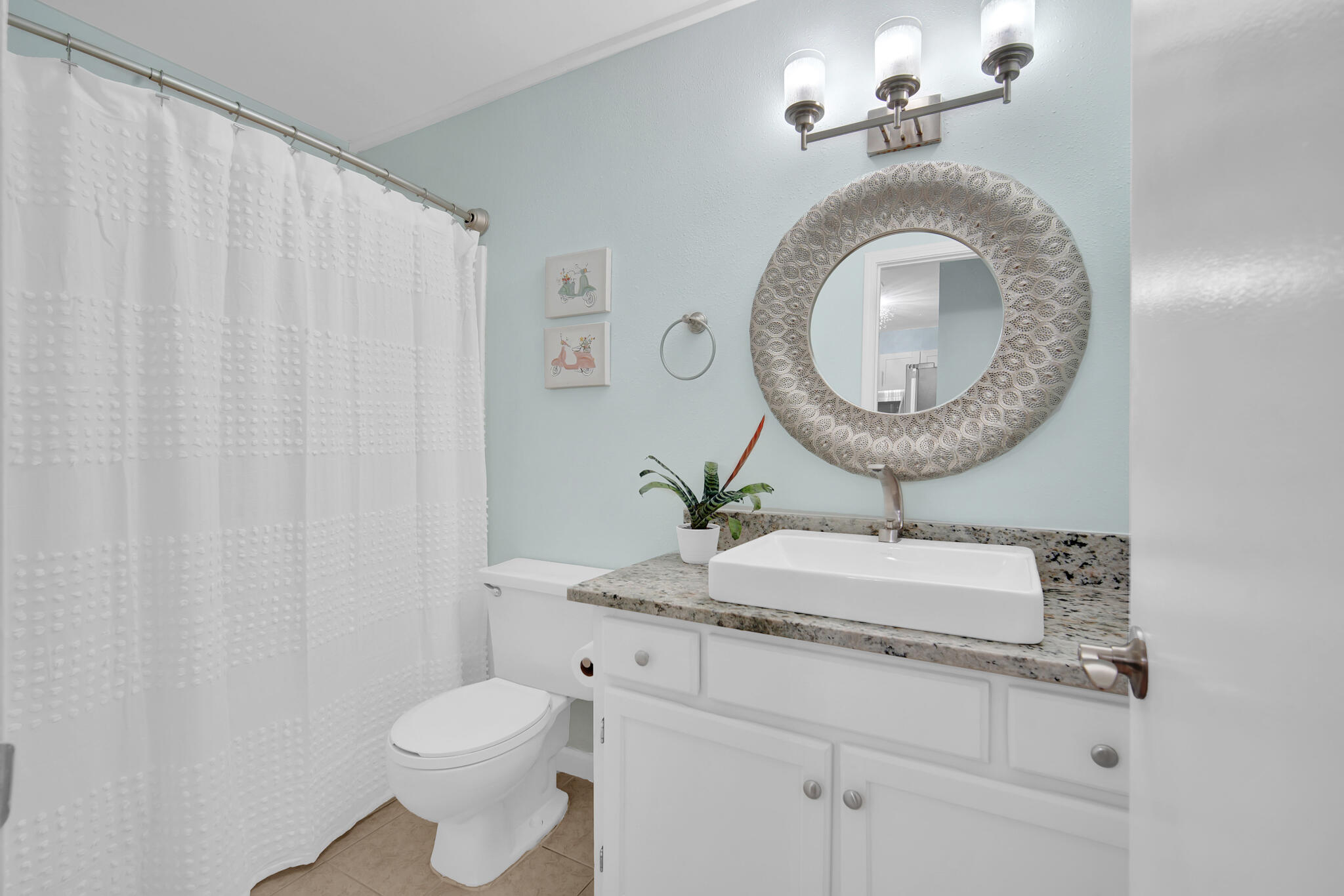 60 Sandprints Drive, Unit E7 Miramar Beach, FL 32550 - Photo 12 of 26 a bathroom with a granite countertop sink vanity mirror and toilet