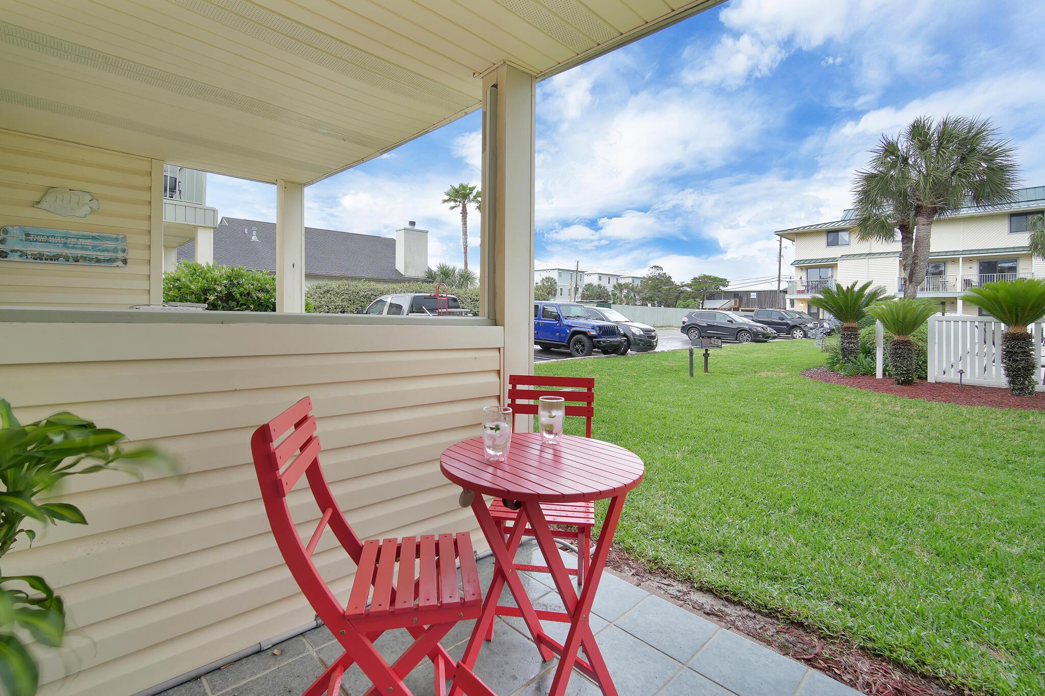60 Sandprints Drive, Unit E7 Miramar Beach, FL 32550 - Photo 17 of 26 a view of a chairs and table in patio of the house